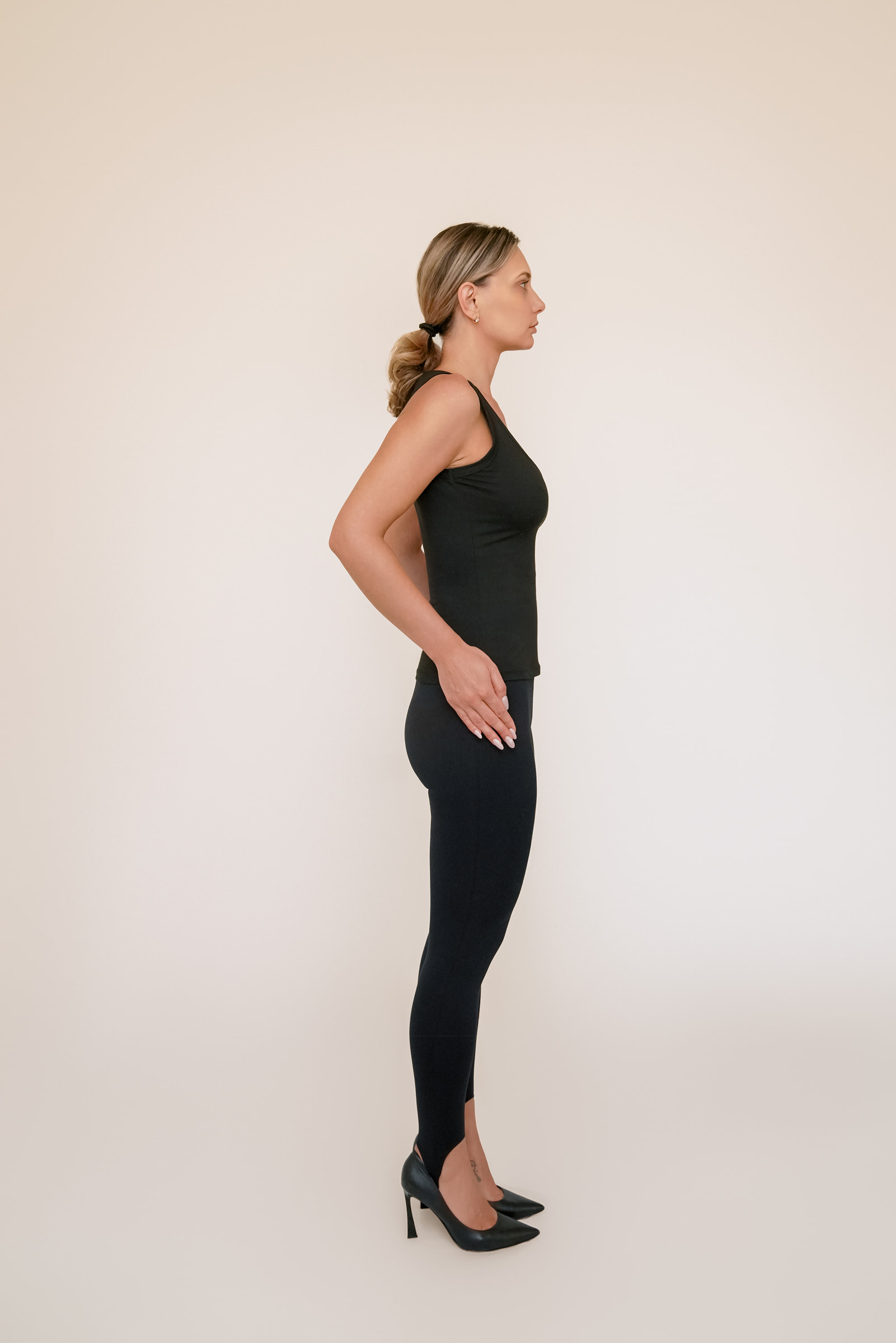 Olesia Prodan in a side-profile full-body pose
